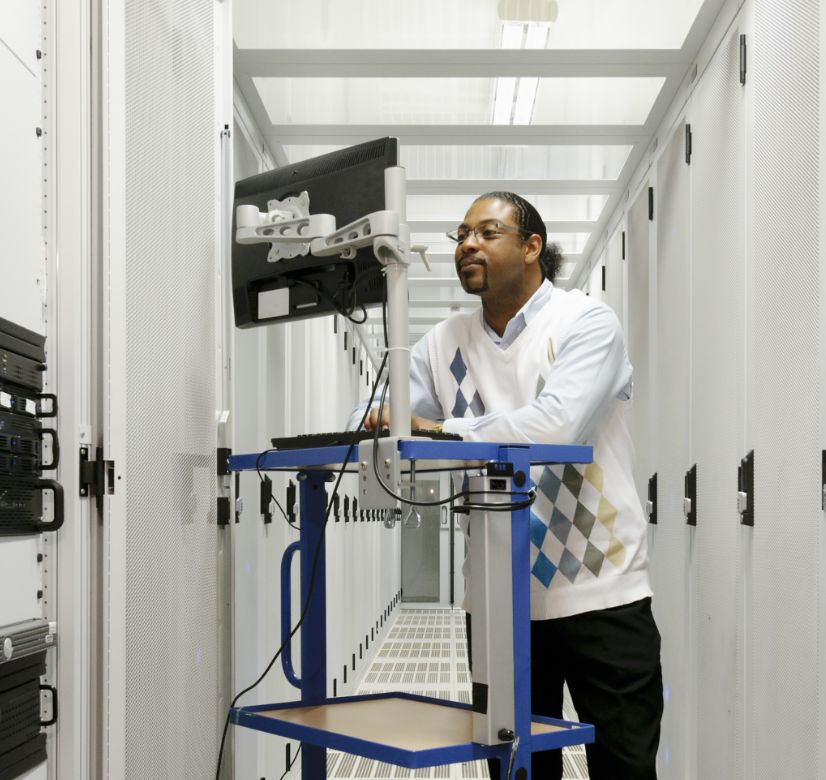 A Black male working in the server room