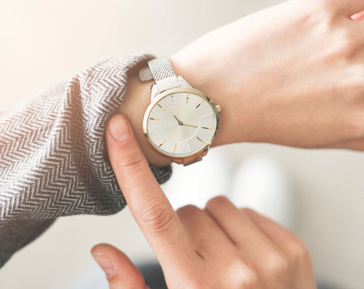 Woman checking time her watch