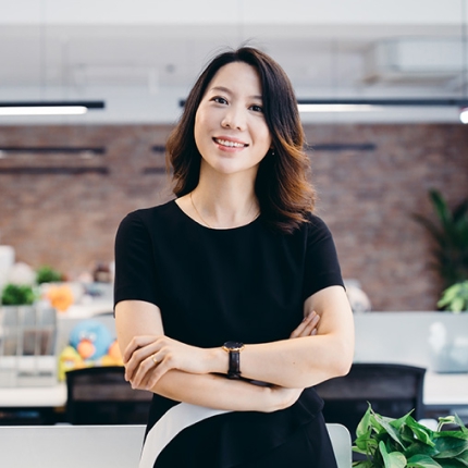 An asian women in an office environment.