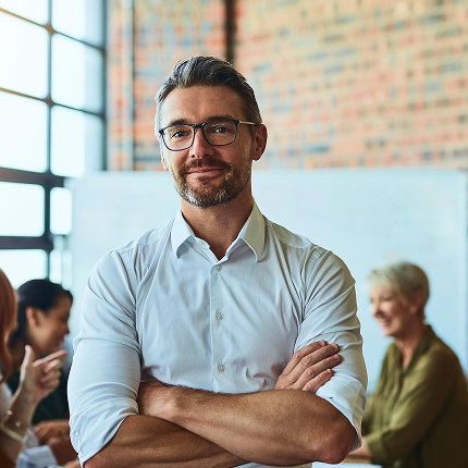 A male in an office environment.